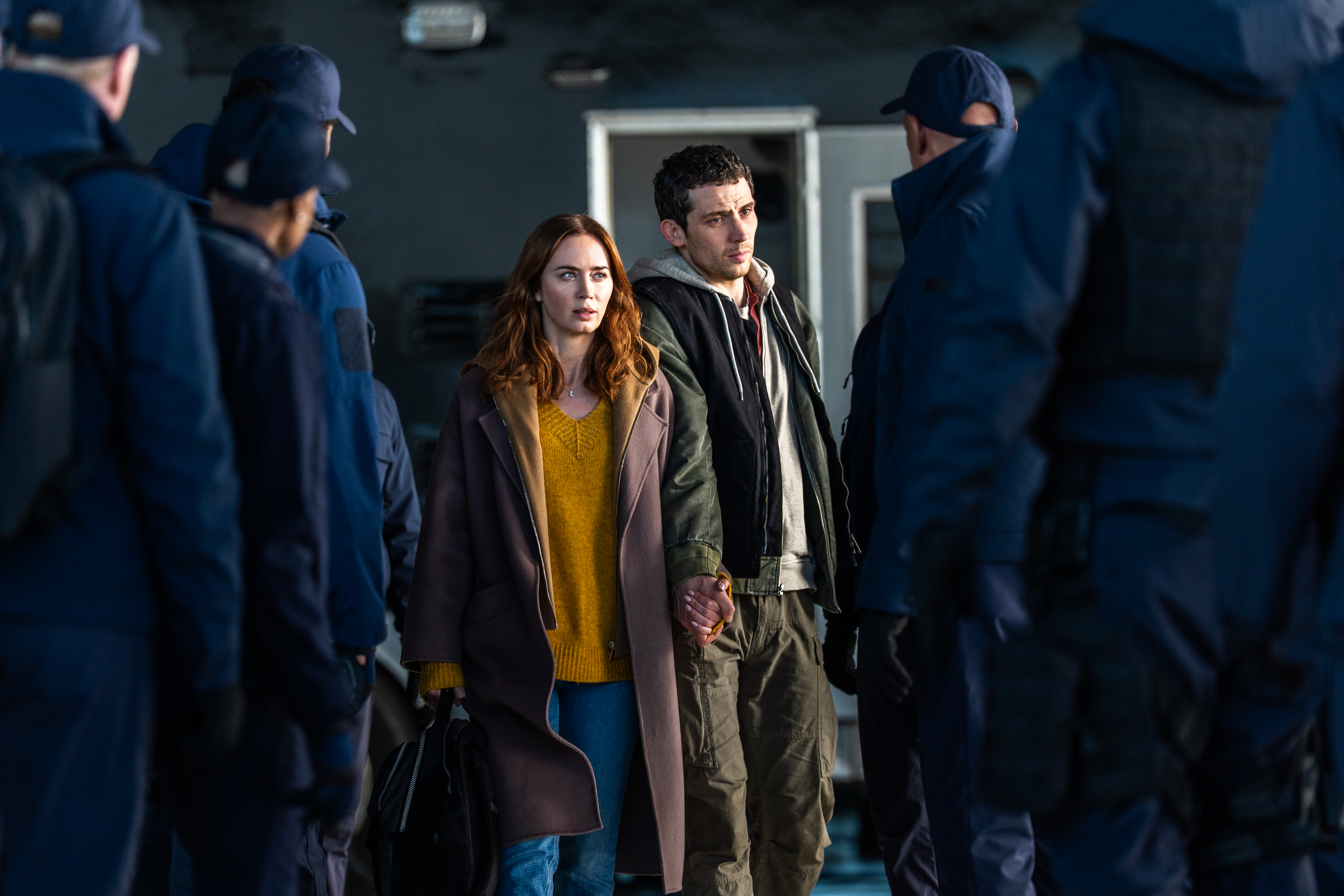 Center L to R: Emily Blunt and Josh O'Connor in DISCLOSURE DAY, directed by Steven Spielberg.